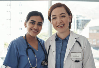 a nurse and doctor smiling